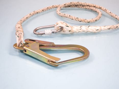 Figure eight knot with carabiner. Silver carabiner with lock andrope isolated on white background.