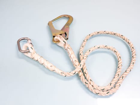 Figure eight knot with carabiner. Silver carabiner with lock andrope isolated on white background.
