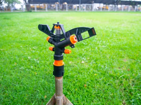 Watering plants and lawns in the garden is the selective focus of Springer.