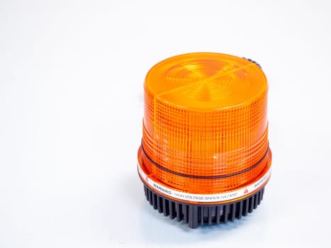 the Orange rotating beacon on white reflective background.