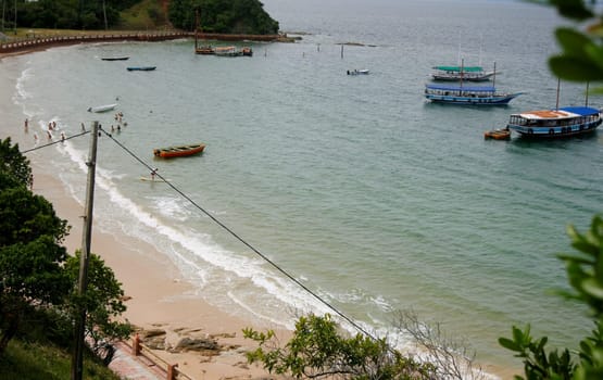 salvador, bahia / brazil - june 12, 2015: People are seen on the Nossa Senhora de Gaudalupe beach on Frades Island in th city of Salvador.