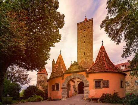 Rothenburg Ob Der Tauber city in Bavaria, Germany, Europe. Tower and wall with sunset sky in background. Old fortifications.