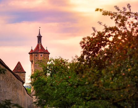 Rothenburg Ob Der Tauber city in Bavaria, Germany, Europe. Tower and wall with sunset sky in background. Old fortifications.