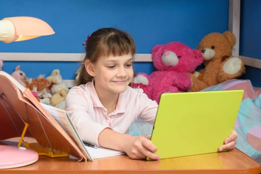 Cheerful girl in self-isolation mode studying at home
