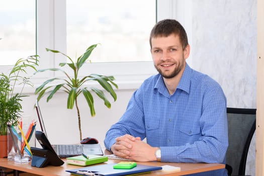 Successful business man in the office at the workplace