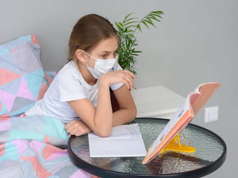 A girl in quarantine performs school homework