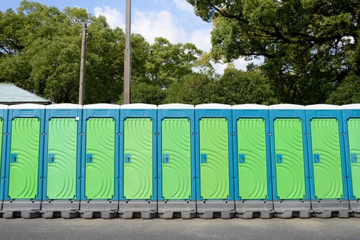 Row of portable toilets for outdoor