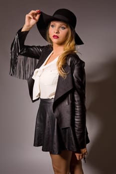 fashion young woman on a grey background