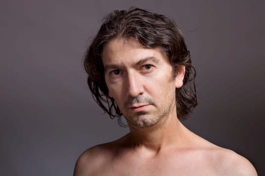 Portrait of young man on a dark background