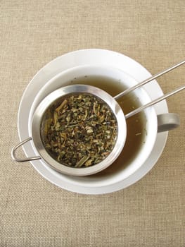 Herbal tea in a tea sieve