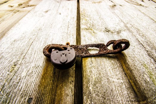 Rusty Old Padlock on Door