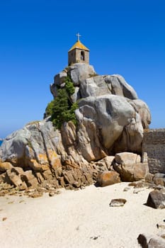 Coast of France in Brittany, the famous small chapel at the rocks in Port-Blanc