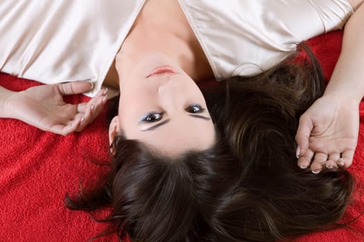 an young beautiful sensual woman in bed
