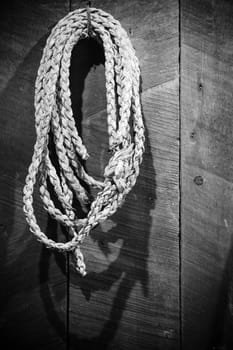 Retro style image of an old cowboy lasso at La Casona historic site in Costa Rica