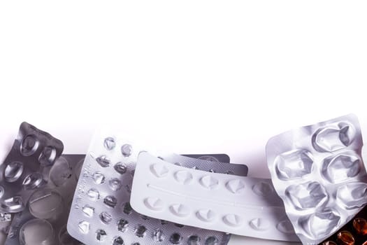 Used prescription pill packets from prescribed medicines. Close up of empty health medicine blister packs with white space above