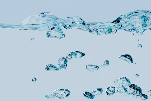 Full-format view of rising air bubbles in the medium of water against a light blue background.