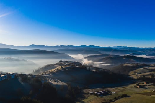 Landscape of fog and mountains in a clear day