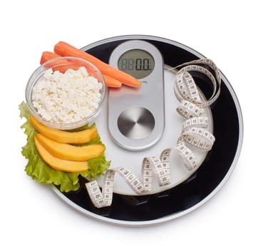 Slimming, diet, and control of weight. Still life with healthy food, scales and measuring tape. Healthy nutrition. Healthy lifestyle concept. Control of weight during the isolation period