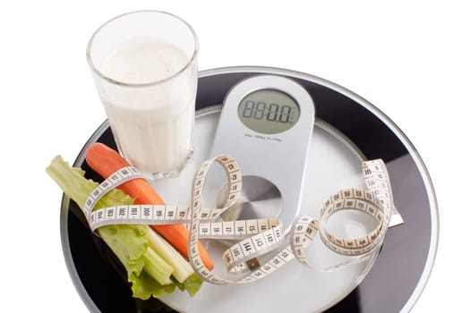 Slimming, diet, and control of weight. Still life with healthy food, scales and measuring tape. Healthy nutrition. Healthy lifestyle concept. Control of weight during the isolation period
