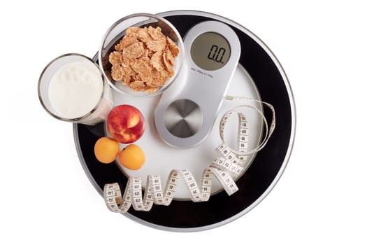 Slimming, diet, and control of weight. Still life with healthy food, scales and measuring tape. Healthy nutrition. Healthy lifestyle concept. Control of weight during the isolation period