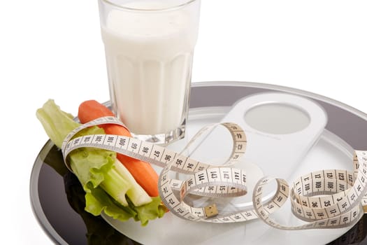 Slimming, diet, and control of weight. Still life with healthy food, scales and measuring tape. Healthy nutrition. Healthy lifestyle concept. Control of weight during the isolation period