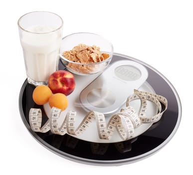 Slimming, diet, and control of weight. Still life with healthy food, scales and measuring tape. Healthy nutrition. Healthy lifestyle concept. Control of weight during the isolation period