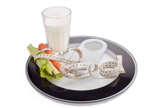 Slimming, diet, and control of weight. Still life with healthy food, scales and measuring tape. Healthy nutrition. Healthy lifestyle concept. Control of weight during the isolation period