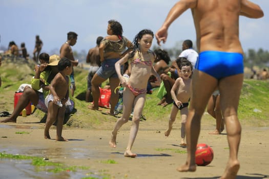 salvador, bahia / brazil - January 1, 2014: People are seen at Itapua Beach in the city of Salvador.