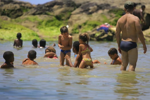 salvador, bahia / brazil - January 1, 2014: People are seen at Itapua Beach in the city of Salvador.