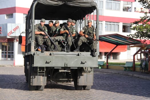 buerarema, bahia / brazil - february 14, 2014: Army soldiers patrol the streets of Buerarema City Center due to series of conflicts involving Tupinamba ethnic Indians and local farmers..