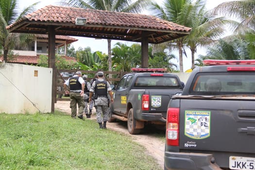 ilheus, bahia / brazil - february 15, 2014: National Force agents survey armed conflict area between farmers and Tupinamba Indians in rural Ilheus.