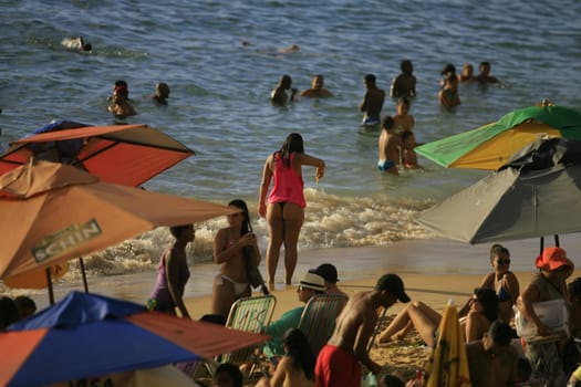salvador, bahia / brazil - april 22, 2014: People are seen at Porto da Barra beach in Salvador city.