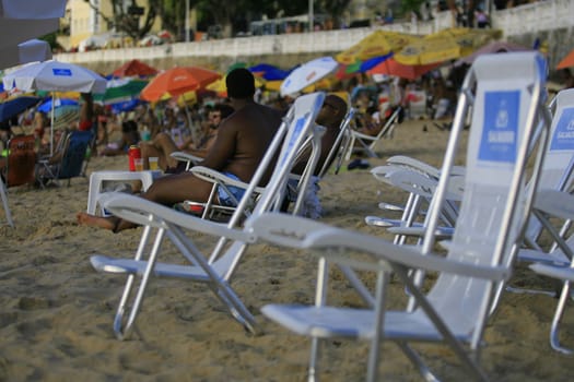 salvador, bahia / brazil - april 22, 2014: People are seen at Porto da Barra beach in Salvador city.