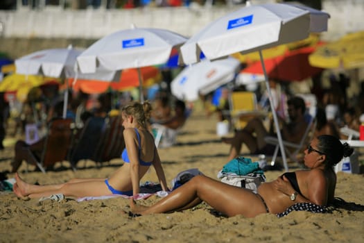 salvador, bahia / brazil - april 22, 2014: People are seen at Porto da Barra beach in Salvador city.