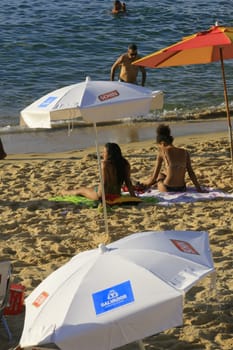 salvador, bahia / brazil - april 22, 2014: People are seen at Porto da Barra beach in Salvador city.