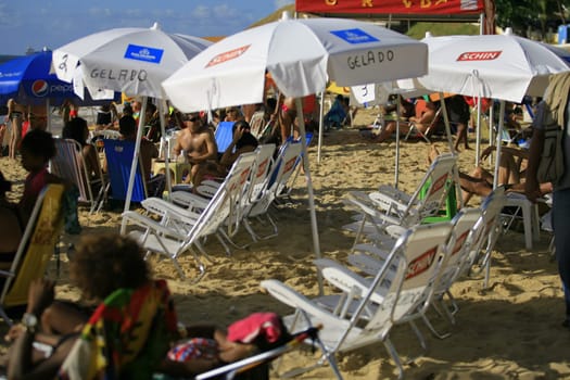 salvador, bahia / brazil - april 22, 2014: People are seen at Porto da Barra beach in Salvador city.