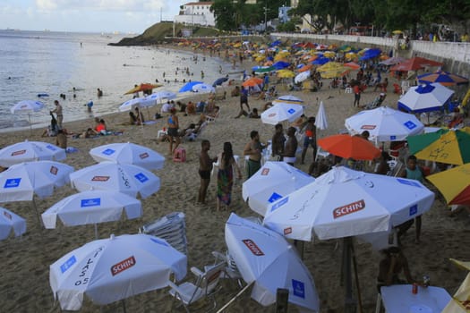 salvador, bahia / brazil - april 22, 2014: People are seen at Porto da Barra beach in Salvador city.
