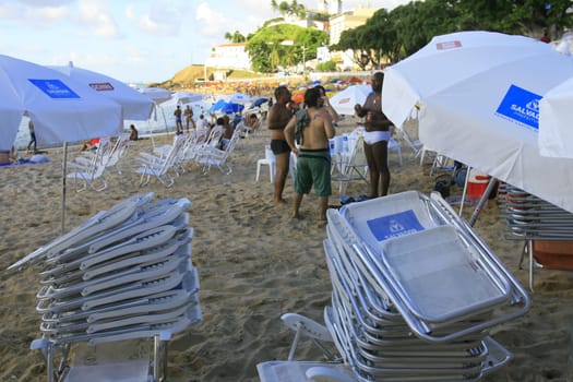 salvador, bahia / brazil - april 22, 2014: People are seen at Porto da Barra beach in Salvador city.