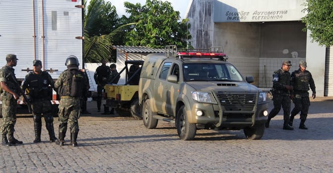 buerarema, bahia / brazil - february 14, 2014: Army soldiers patrol the streets of Buerarema City Center due to series of conflicts involving Tupinamba ethnic Indians and local farmers..