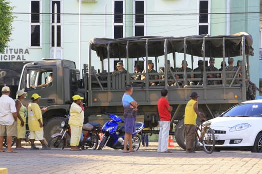 buerarema, bahia / brazil - february 14, 2014: Army soldiers patrol the streets of Buerarema City Center due to series of conflicts involving Tupinamba ethnic Indians and local farmers..