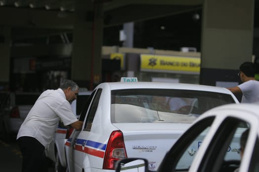 salvador, bahia / brazil - march 10, 2014: Taxi drivers are seen in a row near the Iguatemi Mall in the city of Salvador.