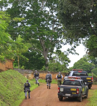 ilheus, bahia / brazil - february 15, 2014: National Force agents survey armed conflict area between farmers and Tupinamba Indians in rural Ilheus.