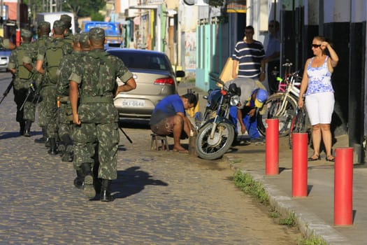 buerarema, bahia / brazil - february 14, 2014: Army soldiers patrol the streets of Buerarema City Center due to series of conflicts involving Tupinamba ethnic Indians and local farmers..