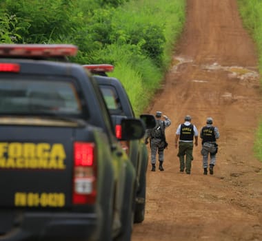 ilheus, bahia / brazil - february 15, 2014: National Force agents survey armed conflict area between farmers and Tupinamba Indians in rural Ilheus.