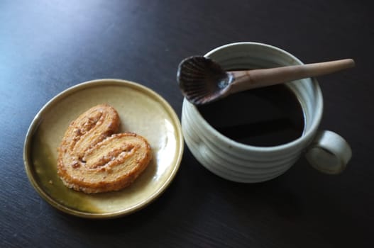 Cookies in the form of heart with coffee . Copy text menu food background.