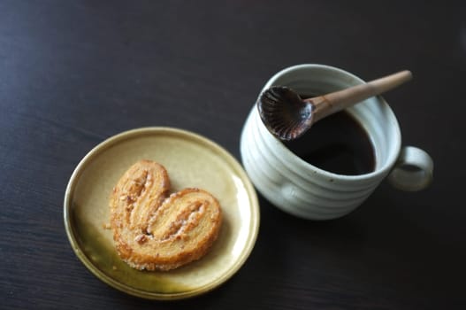 Cookies in the form of heart with coffee . Copy text menu food background.