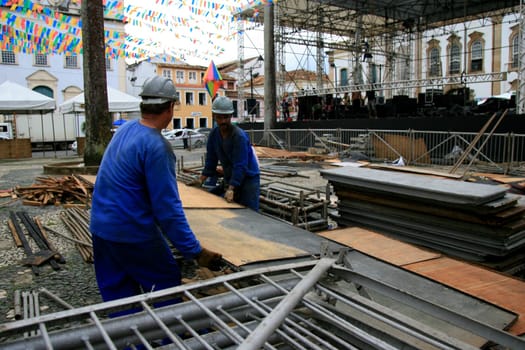 salvador, bahia / brazil - june 19, 2015: Workers are seen working on setting up a stage structure in Pelourinho for the Sao Joao festivities in the city of Salvador....