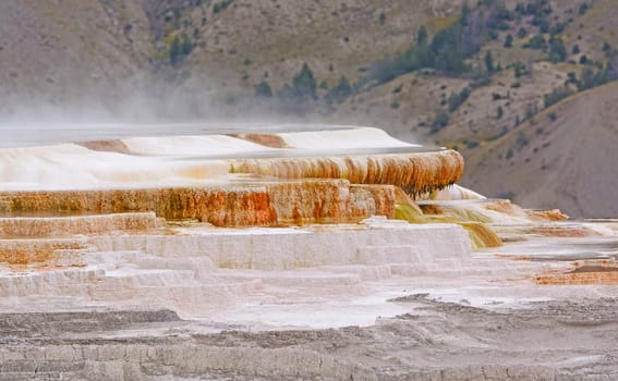 Steam Rising off of Limestone Terraces at Mammoth Hot Springs in Yellowstone Park in Wyoming