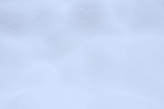 Winter snowdrift landscape background. Soft snow hills surface. Snowy mound texture.