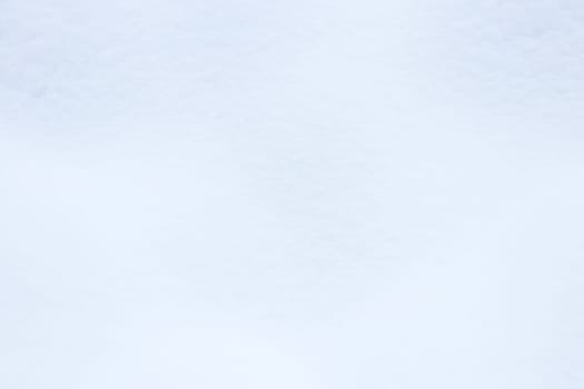 Snowy mound texture. Winter snowdrift landscape background. Soft snow hills surface.